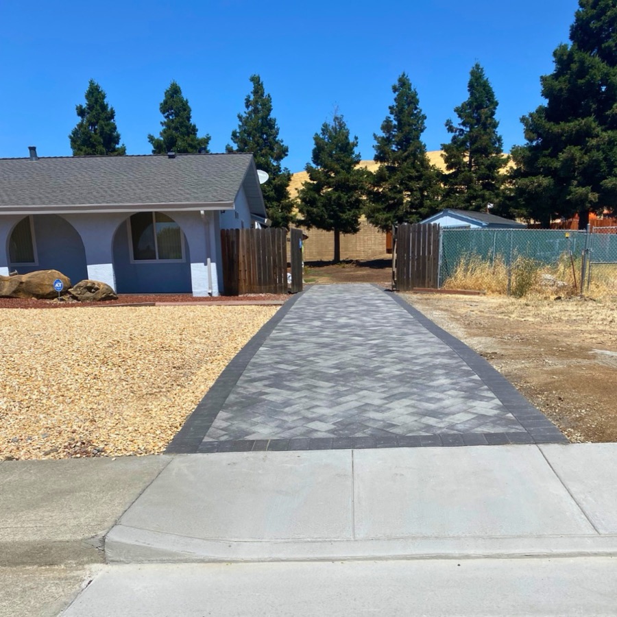 Paver walkway alongside a two-story Bay Area home