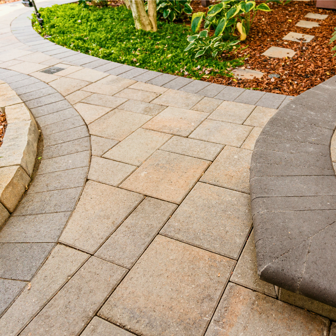 Flexible paver restraint installed along a sweeping garden curve Flexible paver restraint installed along a sweeping garden curve