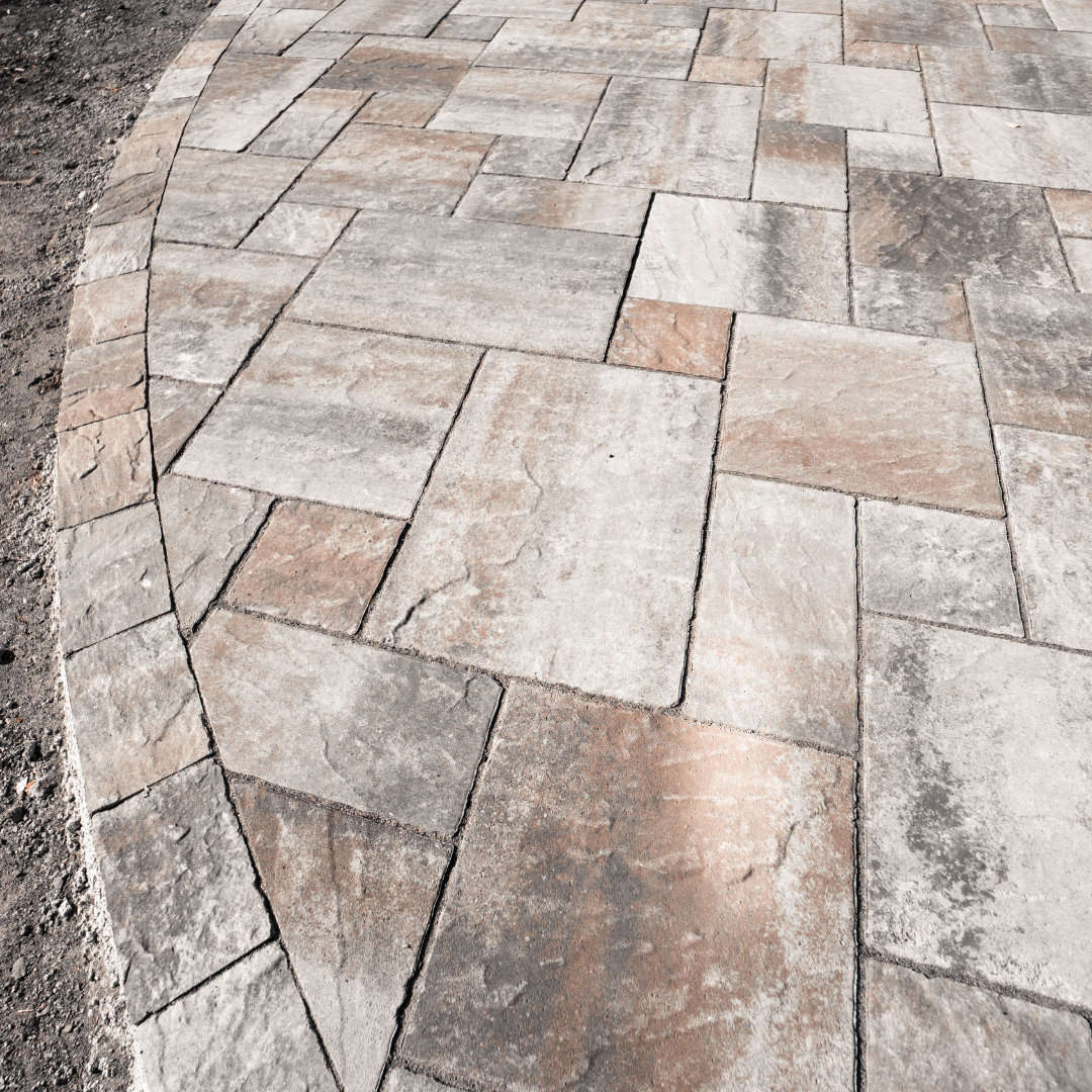 Close-up textures of concrete pavers, natural stone, and brick pavers Close-up textures of concrete pavers, natural stone, and brick pavers