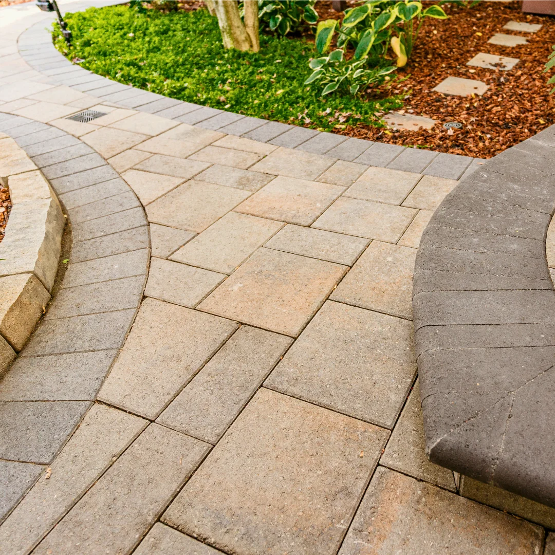 Flexible paver restraint installed along a sweeping garden curve Flexible paver restraint installed along a sweeping garden curve